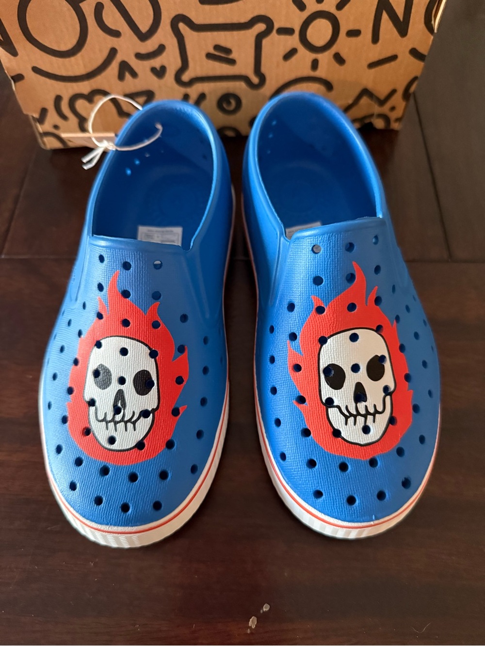 NATIVE -Kids Blue Slip-On Shoes with Flame Skull Graphic (13 little kids)
